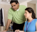Man and woman looking at computer